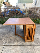 Load image into Gallery viewer, 1960s MCM Walnut Gateleg Dining Table with 4 Hideaway Chairs
